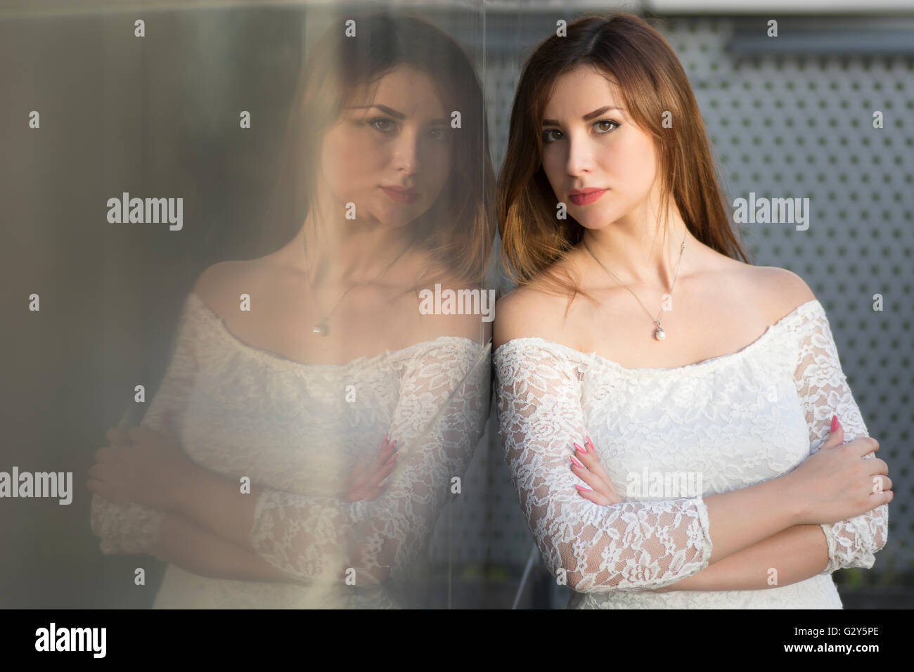 Girl with folded hands hi-res stock photography and images - Alamy