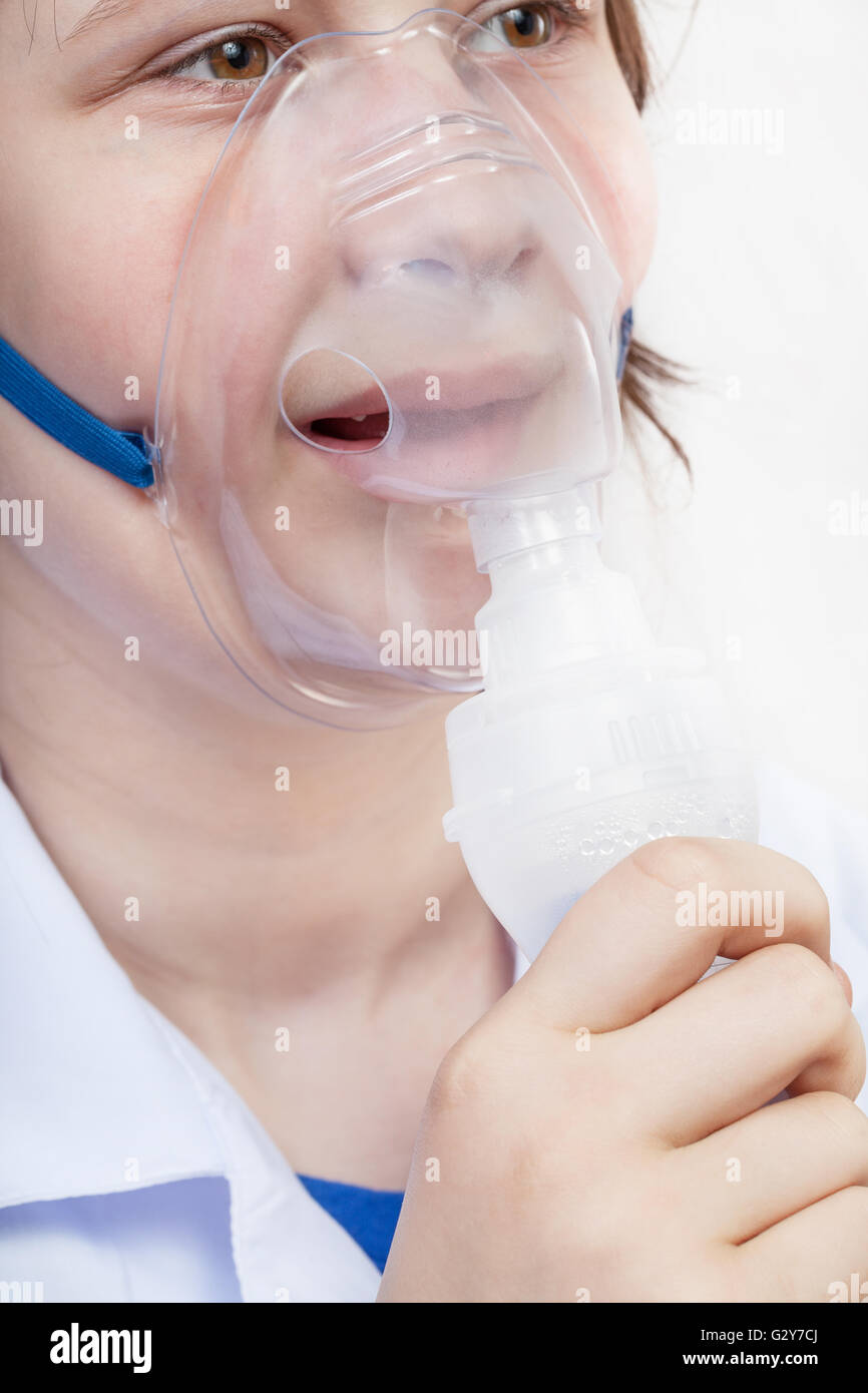 medical inhalation treatment girl inhales with face mask of modern