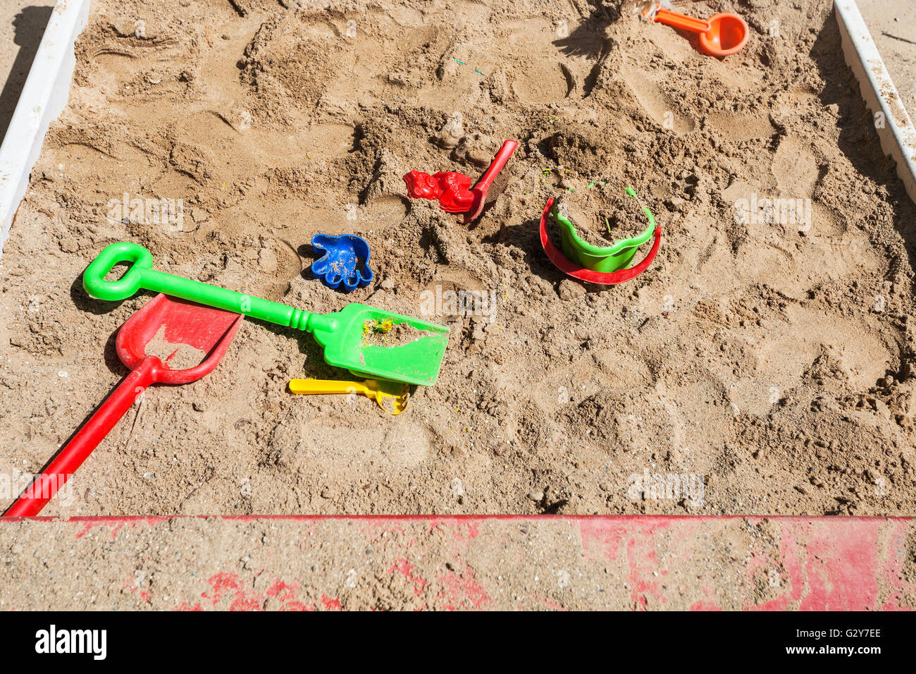 outdoor sandbox with toys on children playground Stock Photo