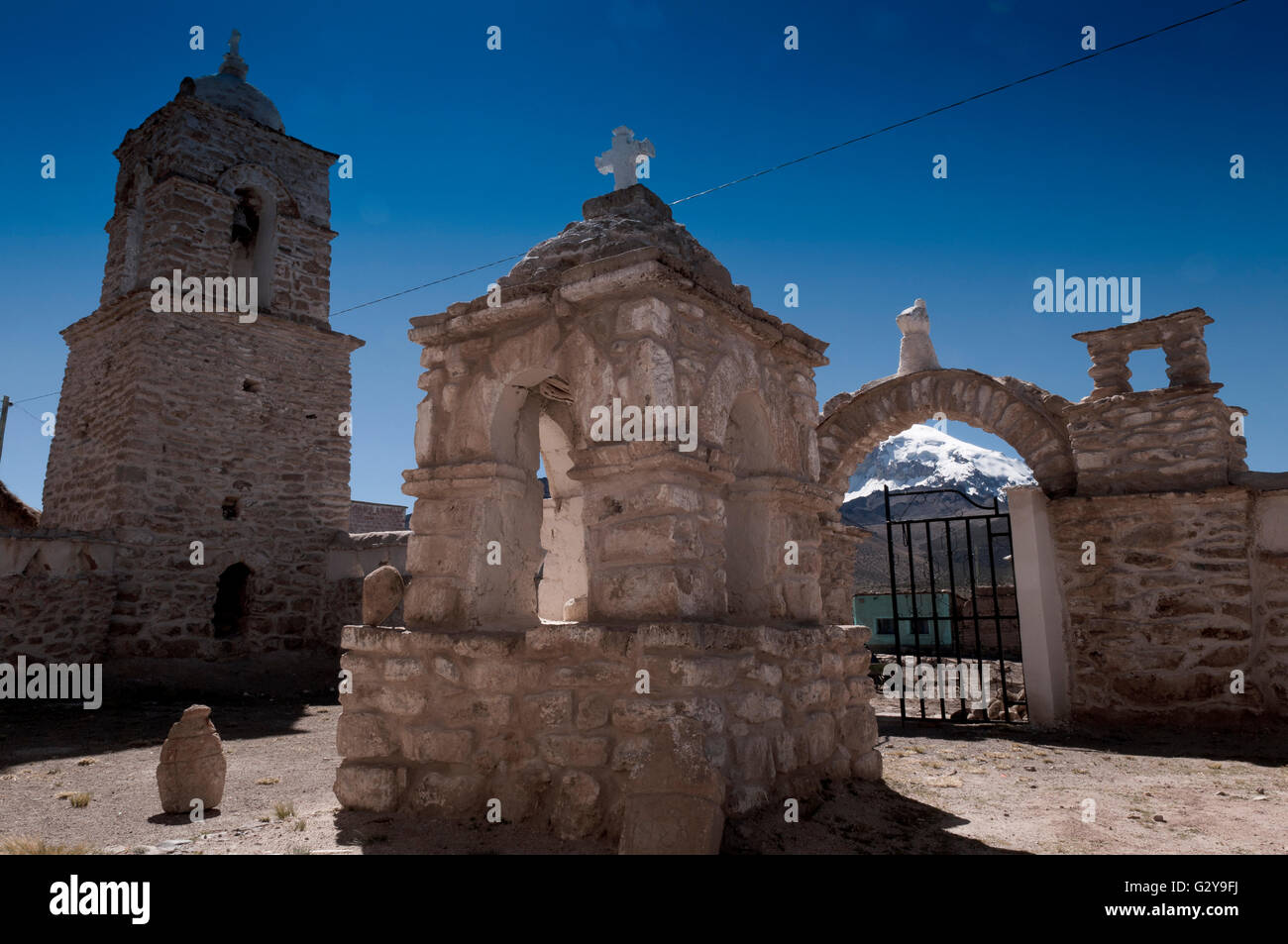 Sajama NP, Church Courtyard And Snow-Capped Volcano In The Background Stock Photo
