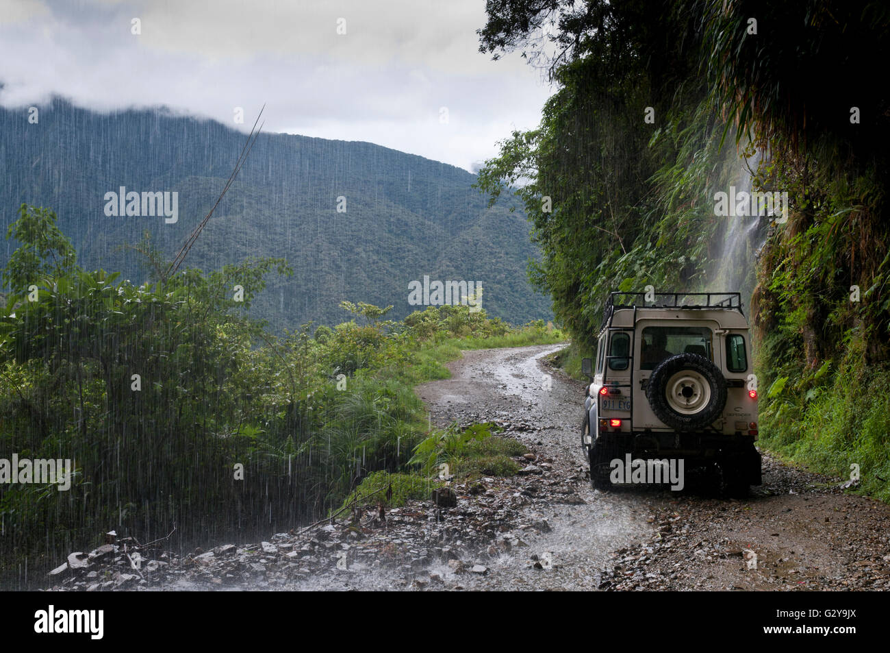 Road La Paz-Coroico, Road of Fate - Yungas Road With Jeep 4WD And Waterfall Stock Photo