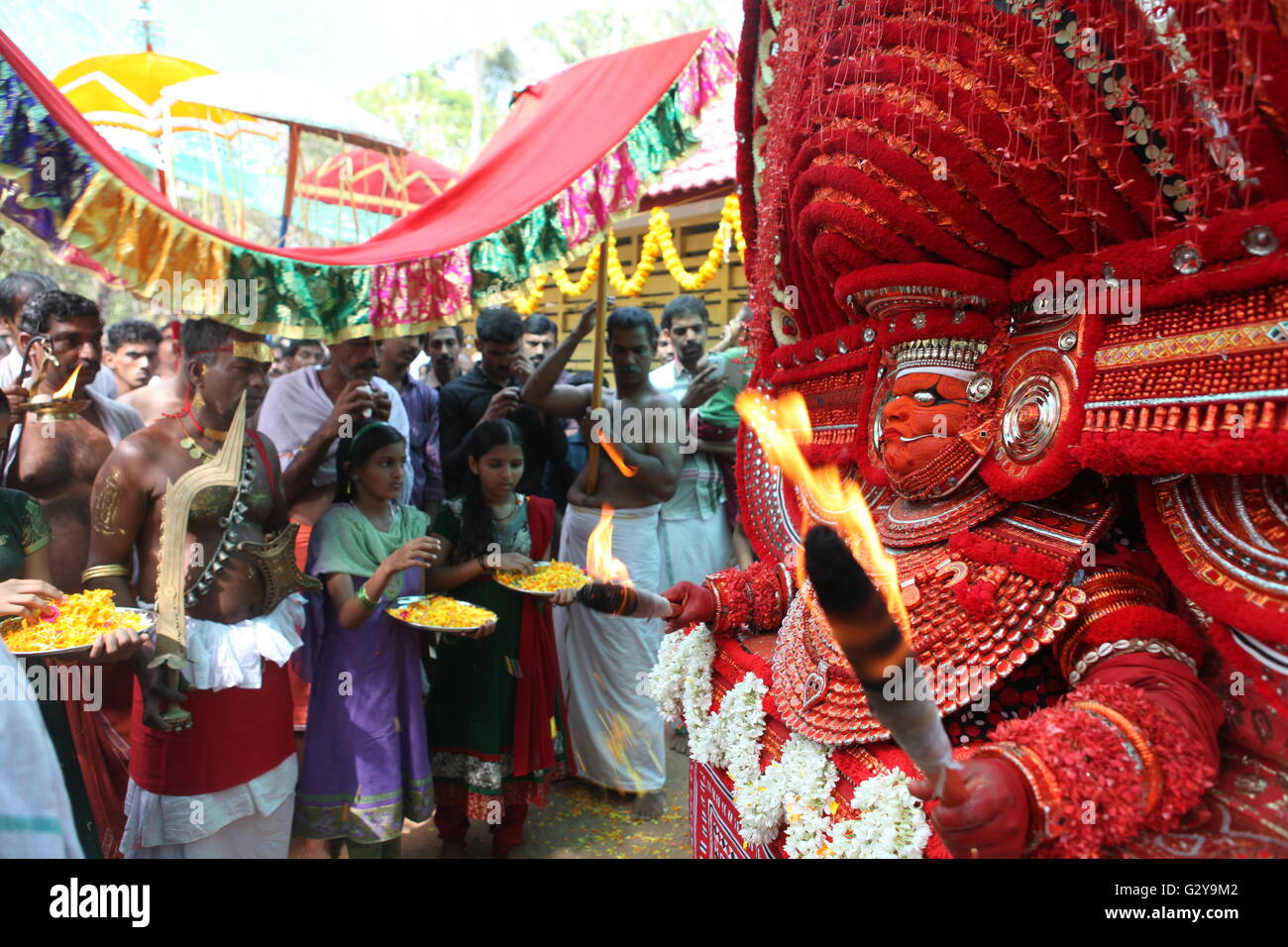 devotees seeking blessings from muchilot bhagavathi theyyam,manifestation of god Stock Photo