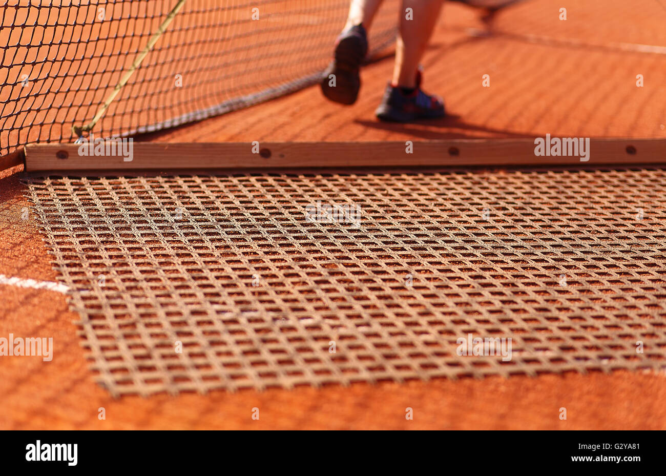 Aligning surface tennis court, with pulling network. Stock Photo