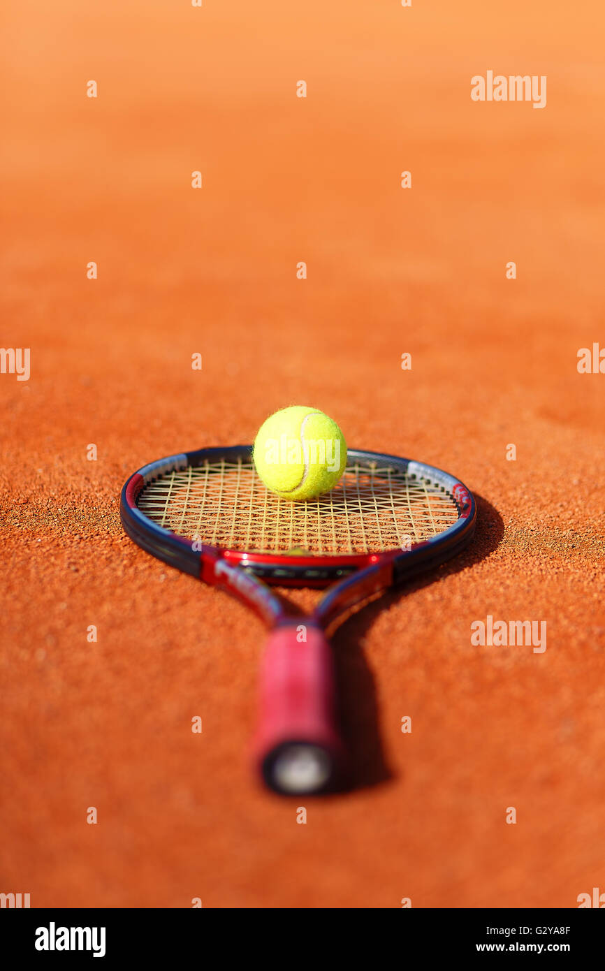 Tennis ball and racket on the court Stock Photo Alamy