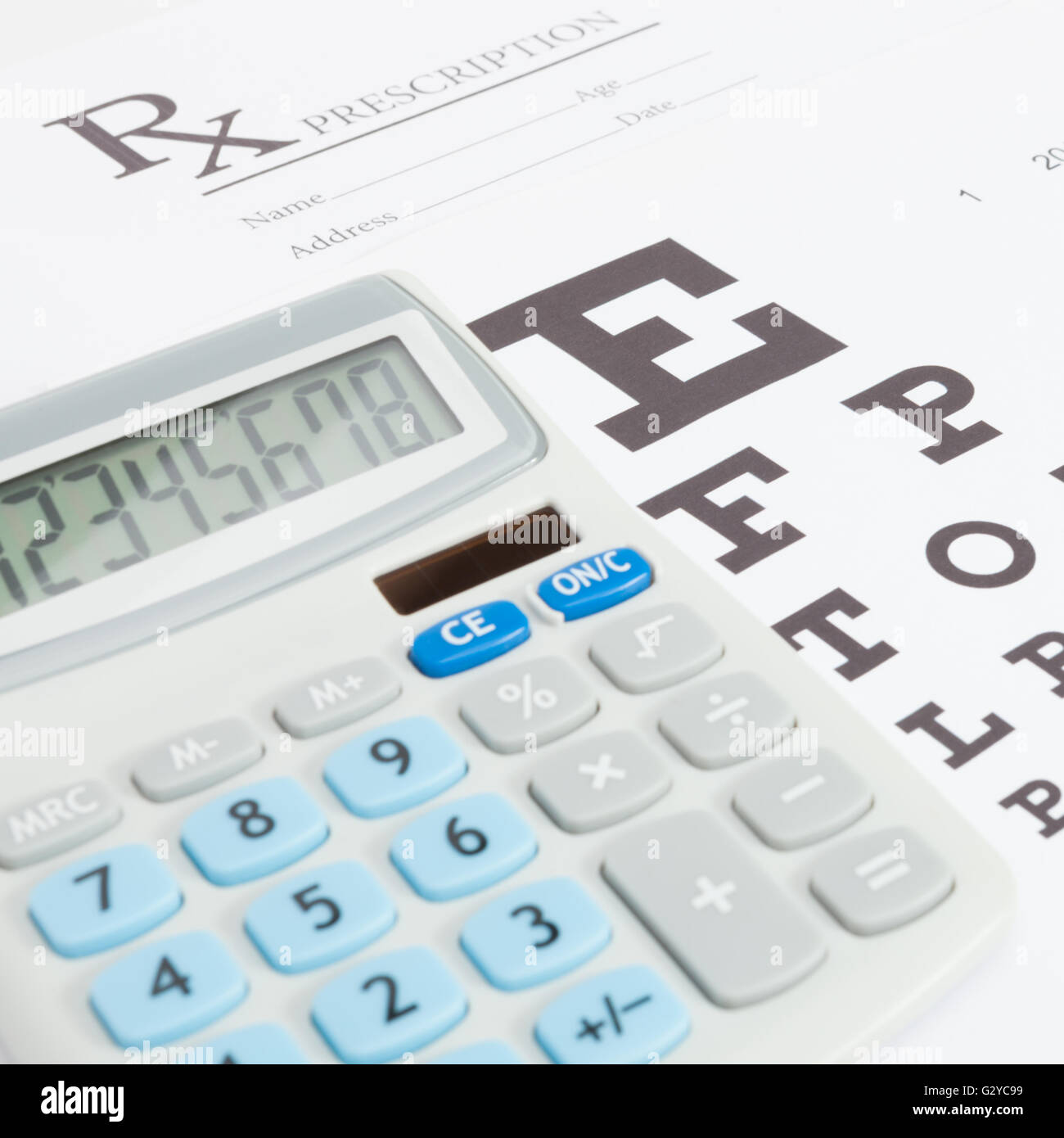 Eyesight test table and medical prescription form with calculator over