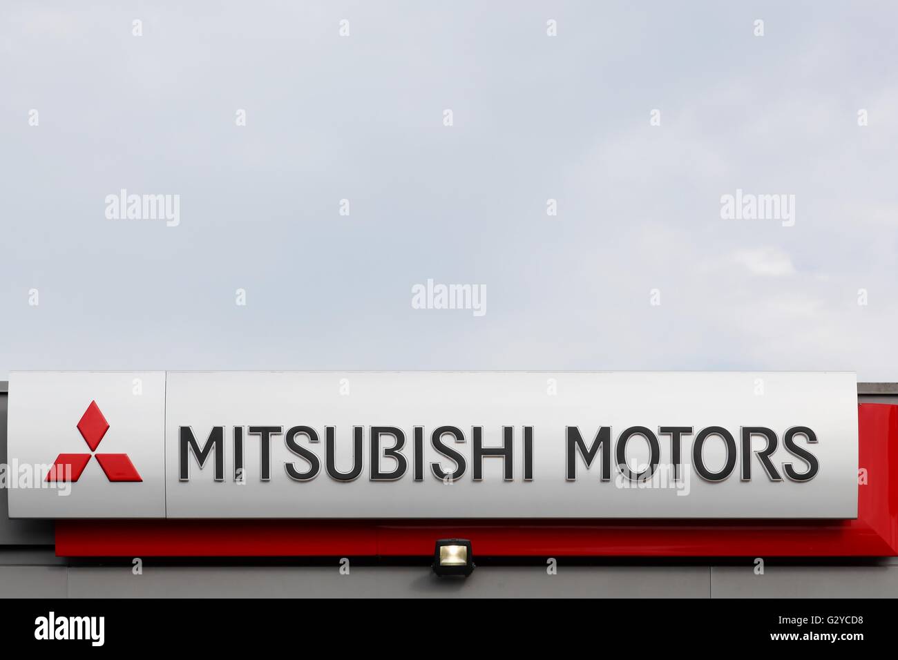 Mitsubishi Motors Corporation sign on a wall Stock Photo