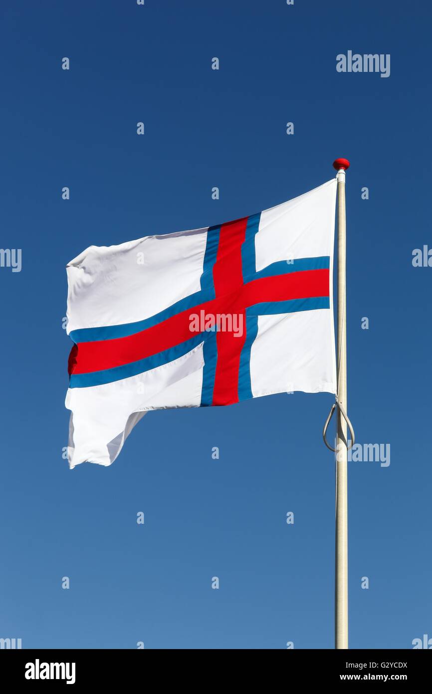 National flag of the Faroe Islands waving in the sky Stock Photo