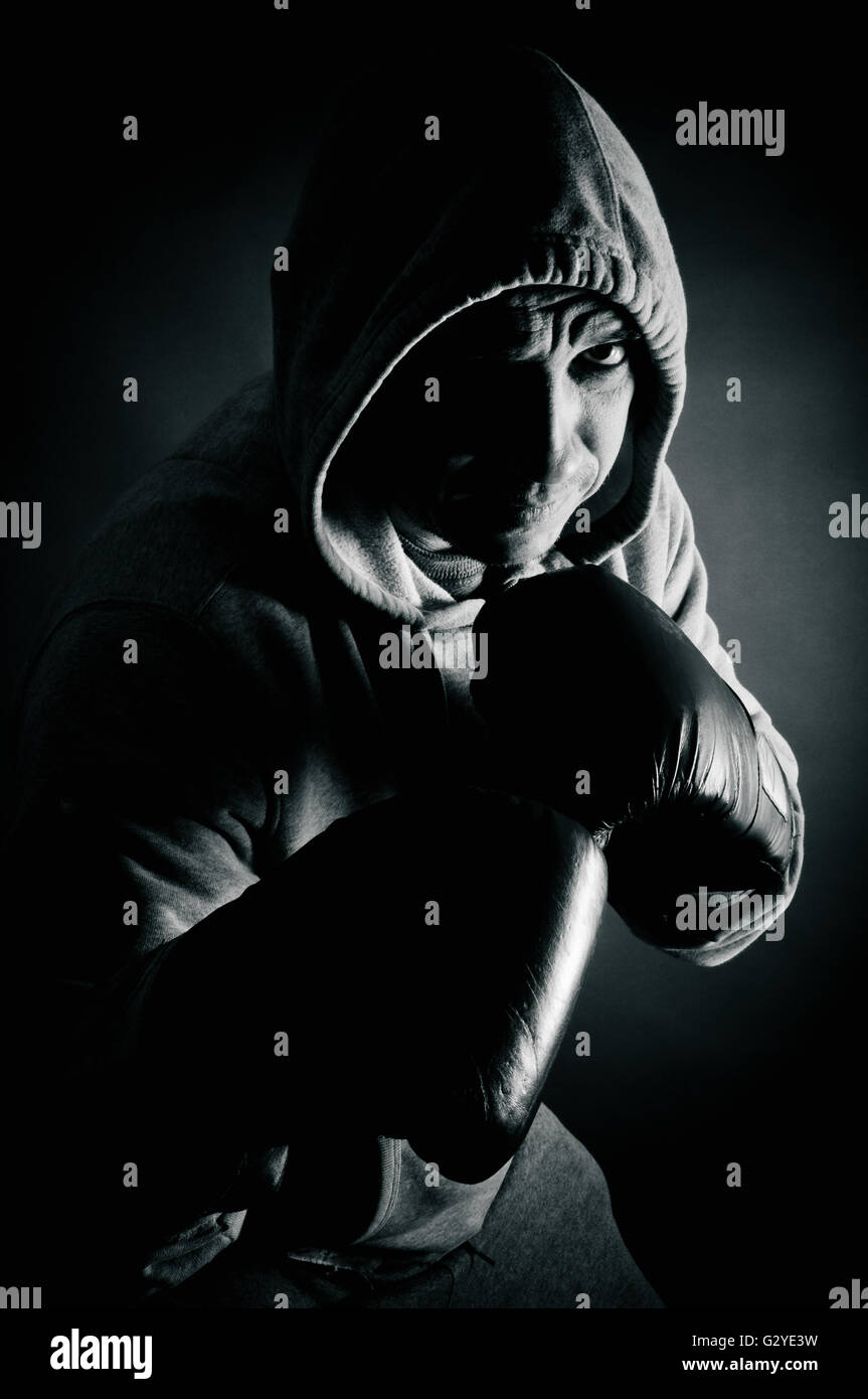 Hooded man boxing Stock Photo Alamy