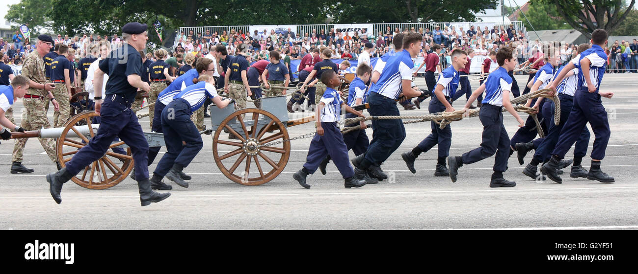 Fareham, Hampshire, UK. 4th June 2016. The most spectacular event took place at HMS Collingwood, Fareham, Hampshire when the establishment opened it gates for the annual Open Day, sponsored by 8 Wealth Management featuring the Royal Navy and Royal Marines Charity (RNRMC) Field Gun Competition.  The Field Gun competition featured crews from across the UK and as far afield as Gibraltar competing for the coveted Brickwoods Trophy. The competition was fast and furious and required 18-man teams to run, dismantle, reassemble and fire the gun in the shortest possible time, traditionally in heats of © Stock Photo