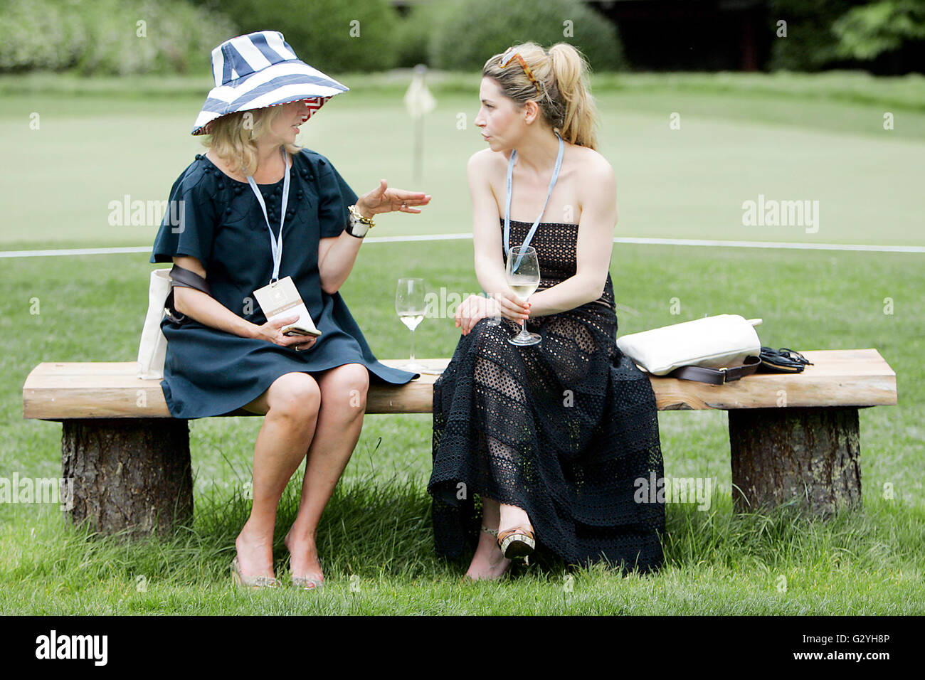 St. Helena, CA, USA. 4th June, 2016. Mary MacRae, left of Yountville, chats with her daughter Grace MacRae of Chicago at Auction Napa Valley at Meadowood Napa Valley on Saturday. © Napa Valley Register/ZUMA Wire/Alamy Live News Stock Photo