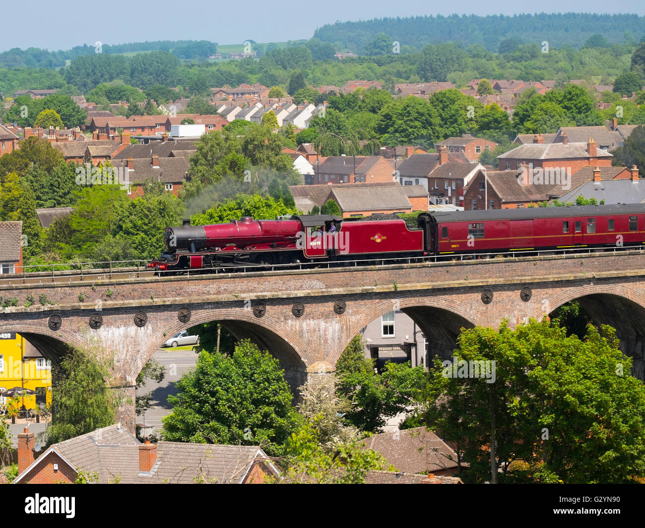 LMS Jubilee Class 45699 Galatea steam locomotive pulls the Cambrian Coast Express through Shifnal, seen from the tower of St. Andrew's Church, Shropshire, England, UK. Stock Photo