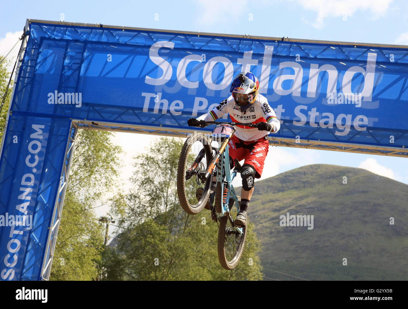 Winner Rachel Atherton jumping through the Scotland Arch on her way to winning the Mountian Bike World Cup at Fort William June 5th 2016. Stock Photo