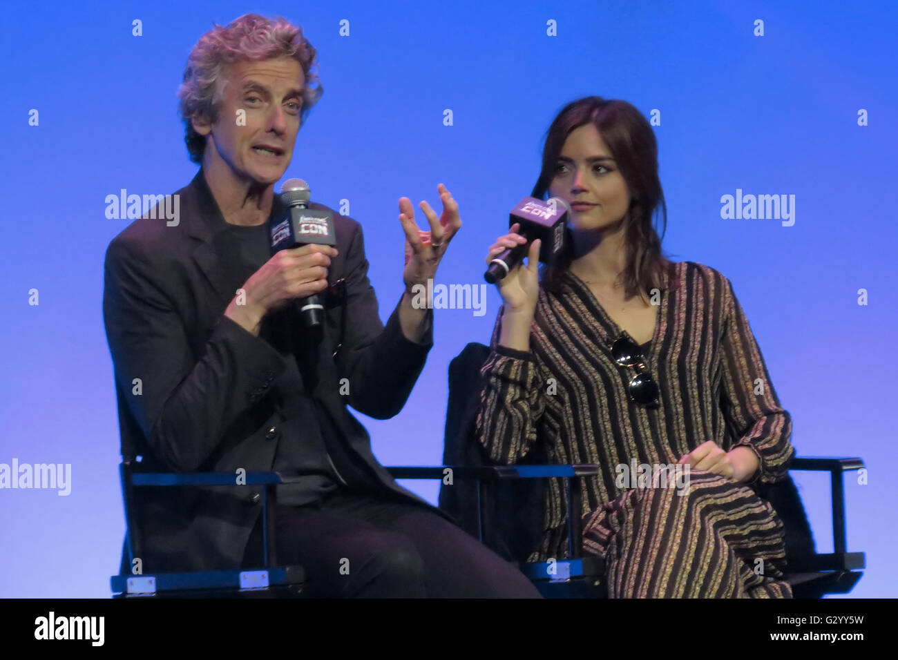 Washington, DC, USA. 5th June, 2016. Doctor Who's Peter Capaldi (the Twelfth Doctor) answering a question as Jenna-Louise Coleman (Clara Oswald) listens at Awesome Con 2016, held in Washington, DC. Credit:  Evan Golub/ZUMA Wire/Alamy Live News Stock Photo