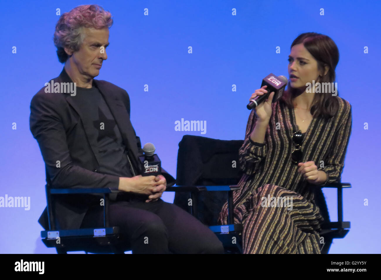 Washington, DC, USA. 5th June, 2016. Doctor Who's Jenna-Louise Coleman (Clara Oswald) answering a question as Peter Capaldi (the Twelfth Doctor) listens at Awesome Con 2016, held in Washington, DC. Credit:  Evan Golub/ZUMA Wire/Alamy Live News Stock Photo