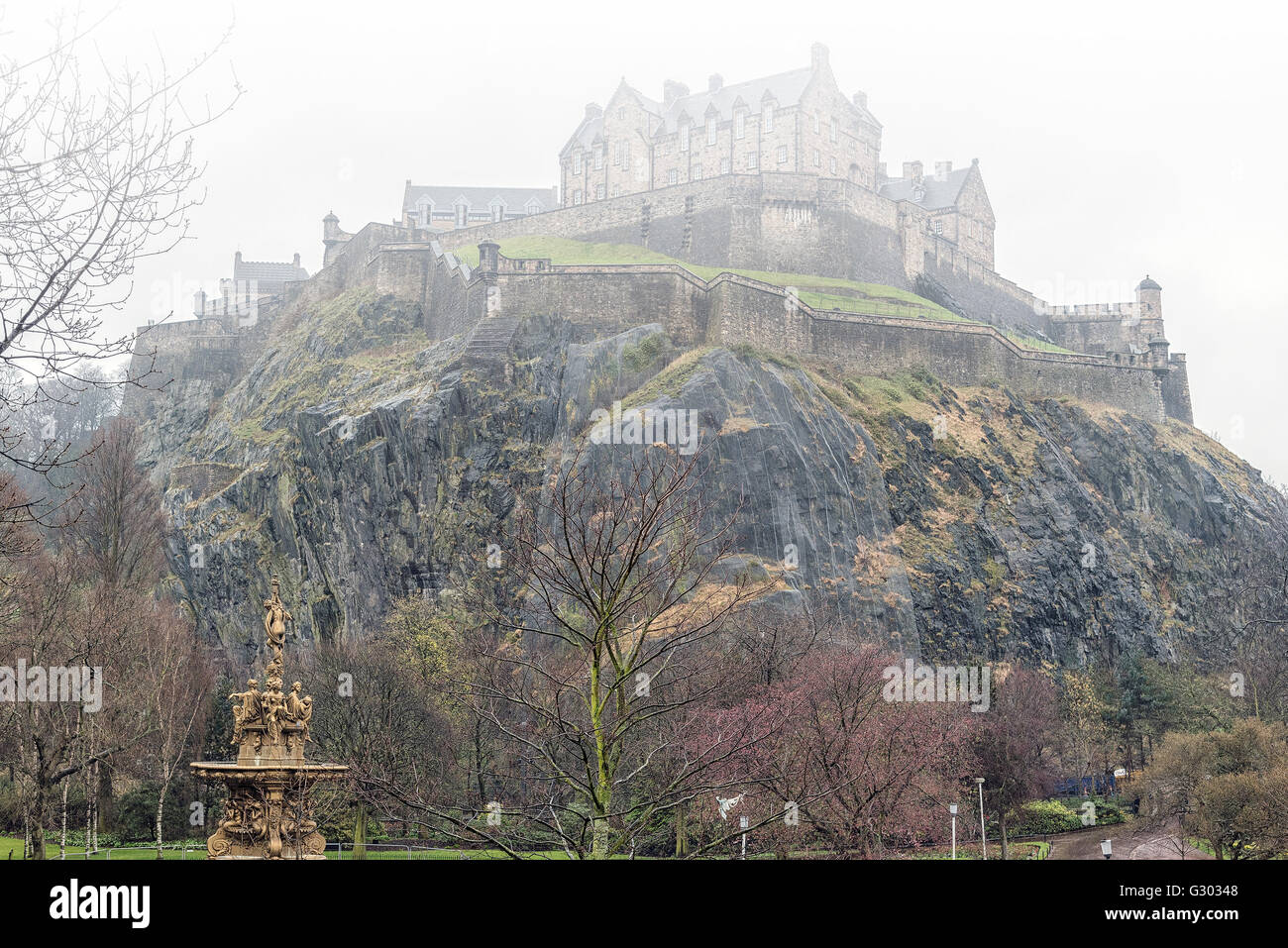 A typical rainy day in Edinburgh with the castle covered in mist in the background. Stock Photo