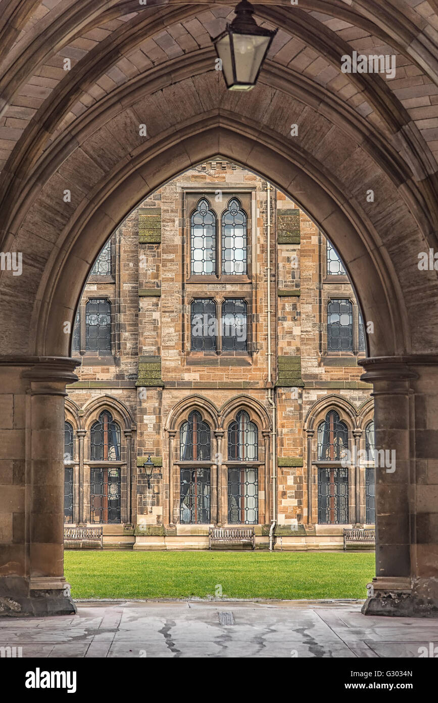 A view of the courtyard at Glasgow university through one of the many arches that are part of the main victorian building. Stock Photo