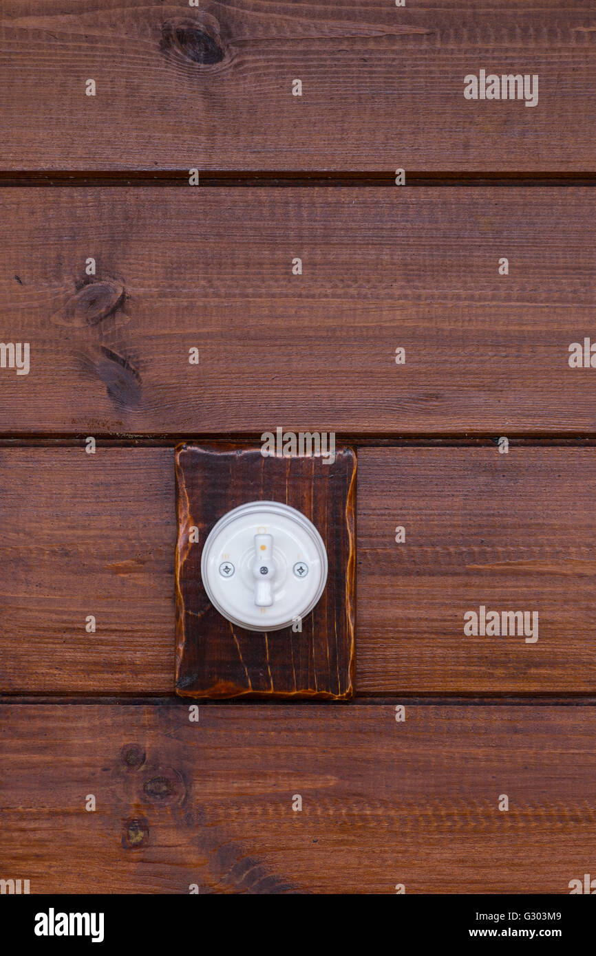 Retro light switch on wooden background Stock Photo