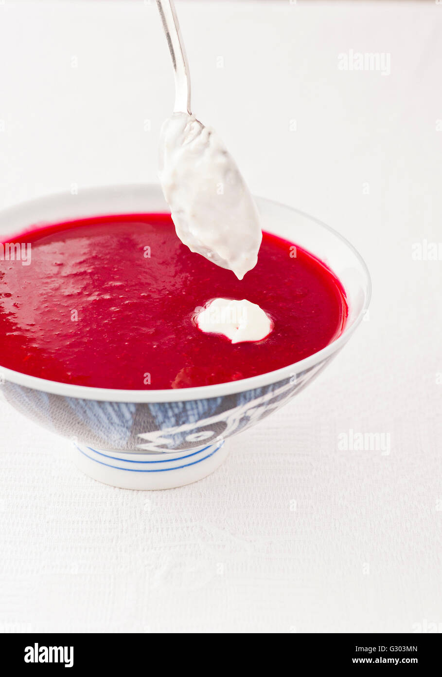 Borscht, traditional Russian beetroot soup, served chilled with sourcream topping Stock Photo