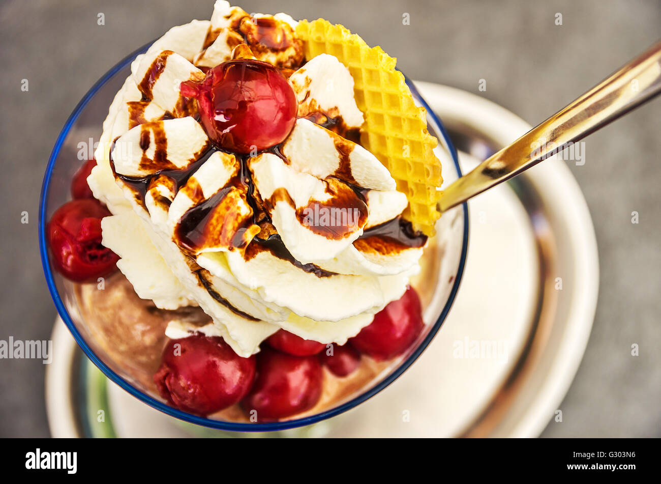 Sundae with cherries and whipped cream. Stock Photo