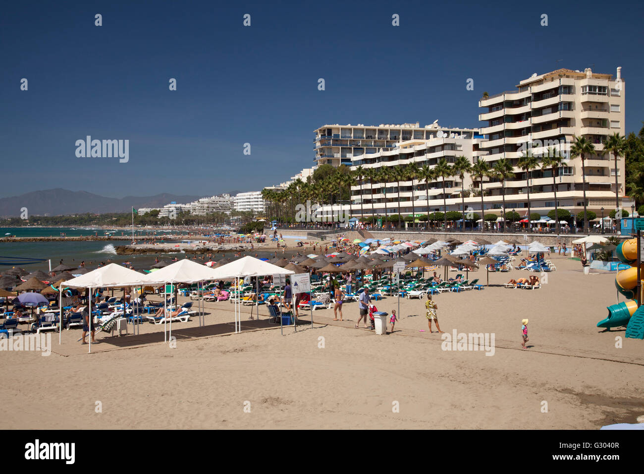 Busy beach, Marbella, Costa del Sol, Andalusia, Spain, Europe, PublicGround Stock Photo