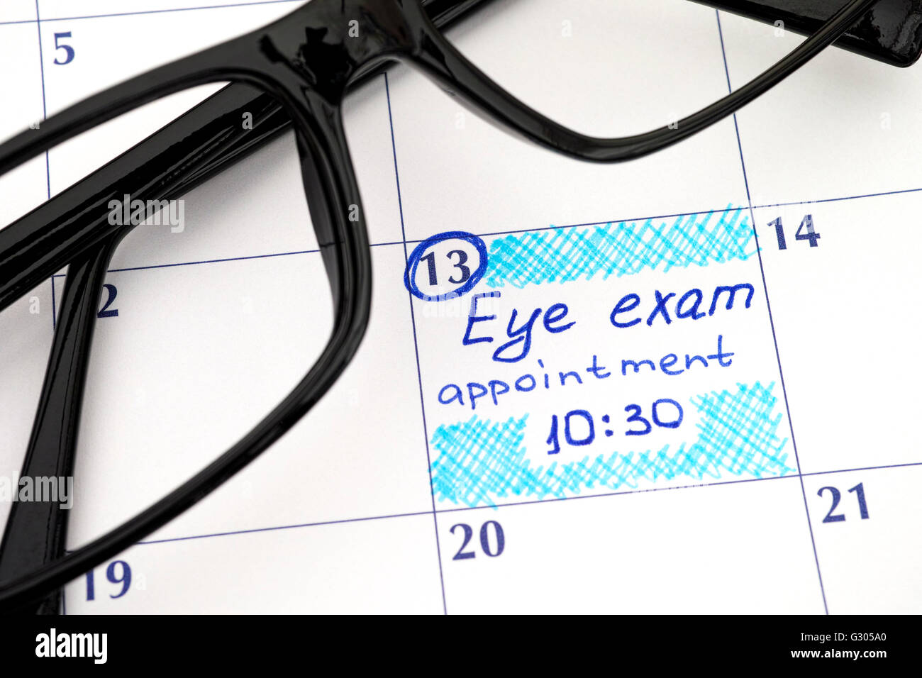 Reminder Eye exam appointment 1030 in calendar with glasses Stock