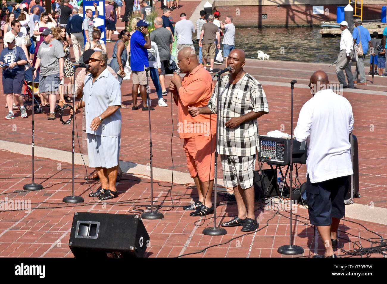 A group of men perform some blues in the Baltimore inner harbor Stock ...