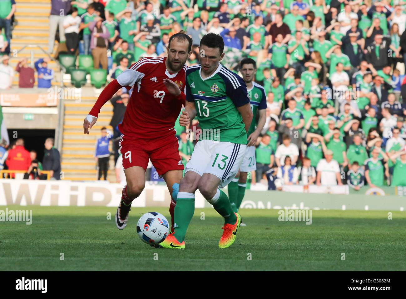 27th May 2016 - Vauxhall International Challenge (Friendly). Northern Ireland 3 Belarus 0. Northern Ireland's Corry Evans (13) and Belarus' Ihar Stasevich challenge for the ball. Stock Photo