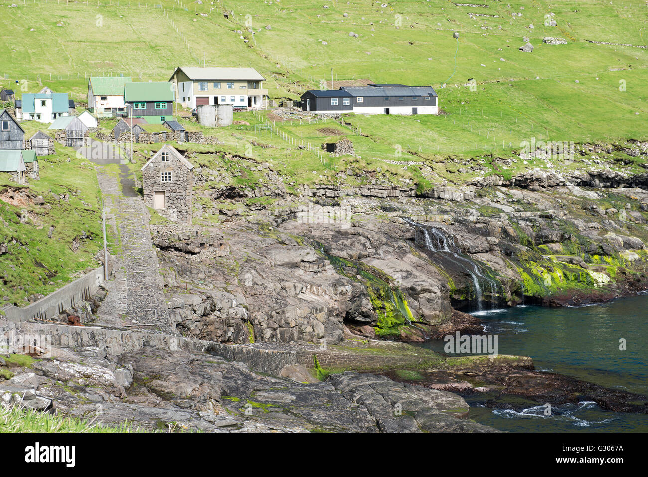 Typical landscape on the Faroe Islands, with the village Hattarvik Stock Photo