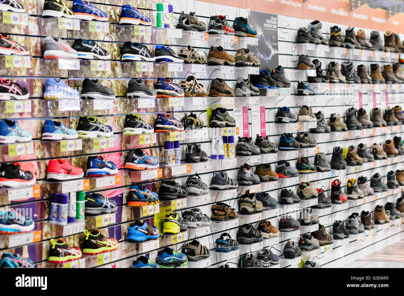 Running and walking shoes, boots and sandals on sale at a Go Outdoors sports shop. Stock Photo