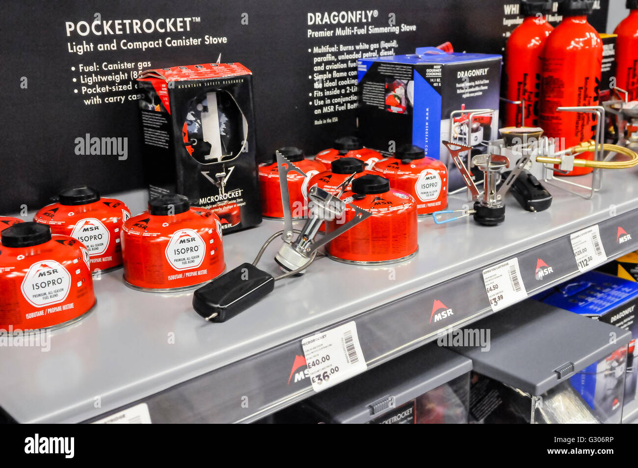 Portable camping stoves, gas canisters and accessories on sale in the camping section of Go Outdoors sports shop. Stock Photo