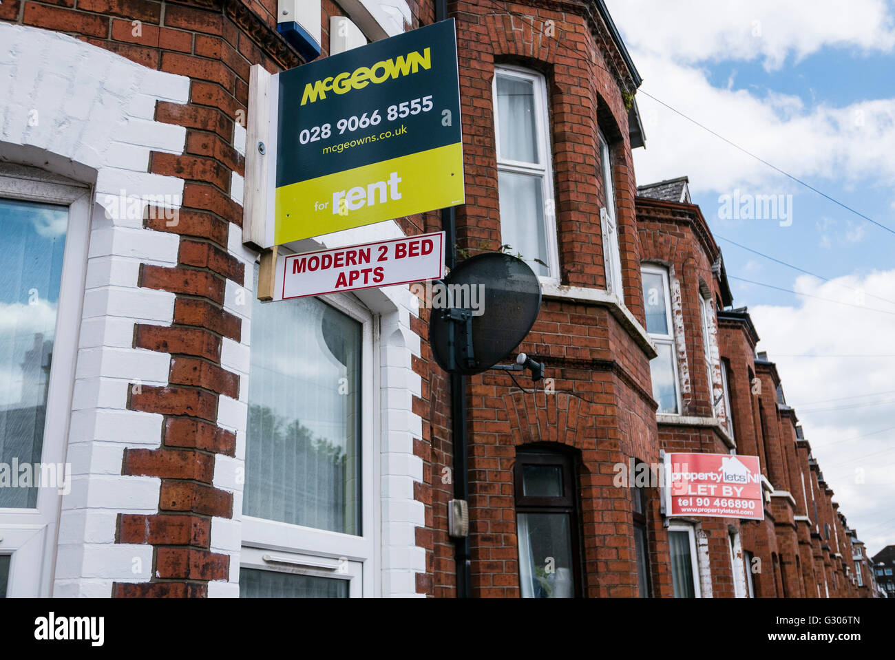Estate agent signs advertising two-bedroom apartments, two story houses which have been converted into HMOs. Stock Photo