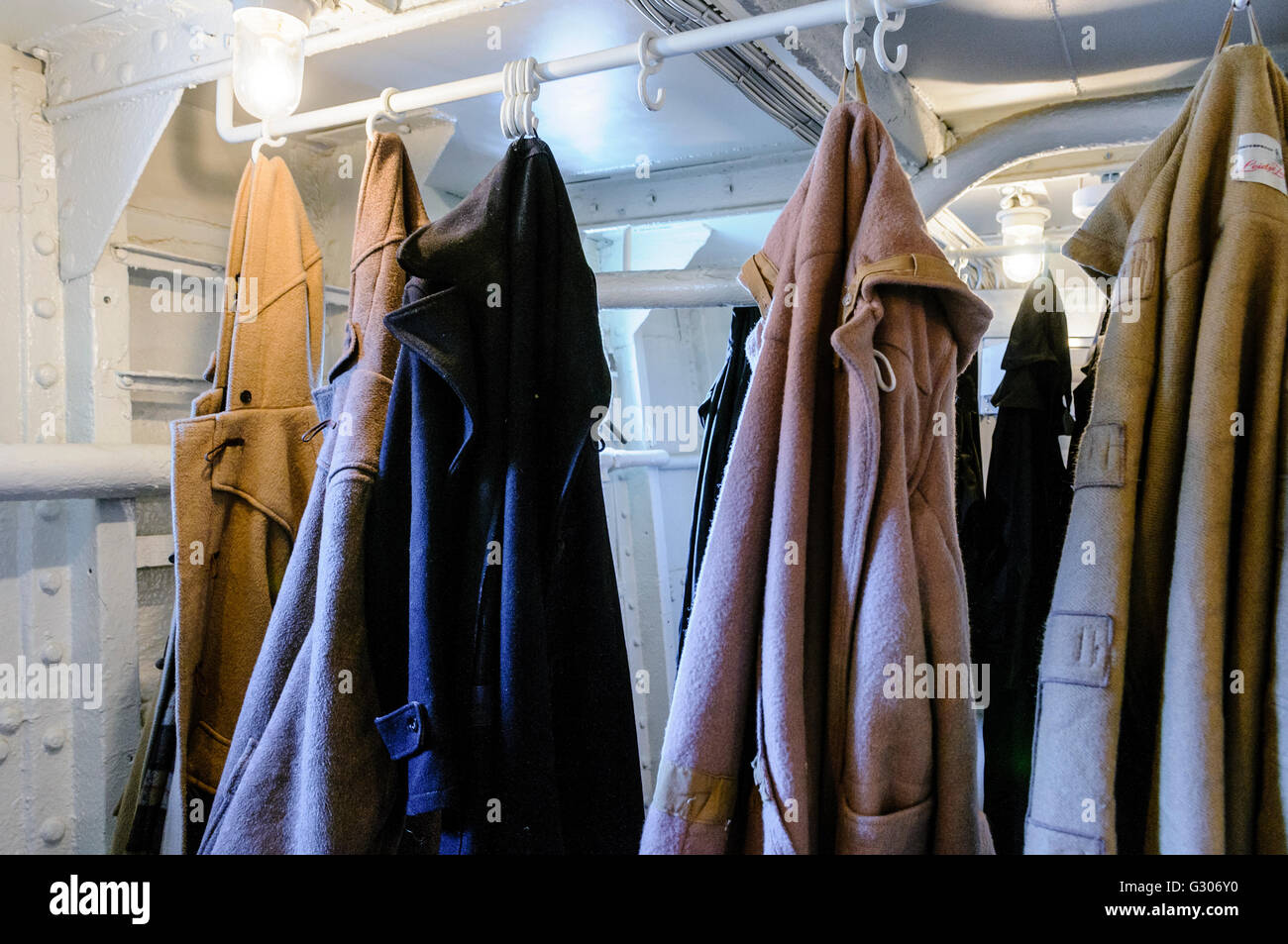 Crew duffle coats hanging up in an old ship. Stock Photo