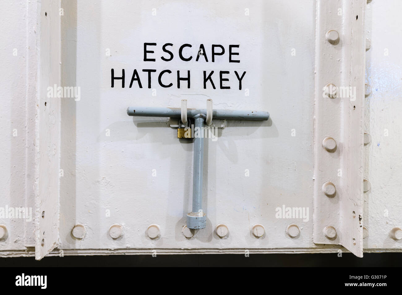 Escape Hatch 'T' Key on a ship for emergency use. Stock Photo