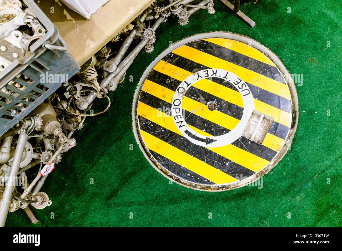 Escape Hatch on a ship for emergency use, which requires a 'T' key to open. Stock Photo