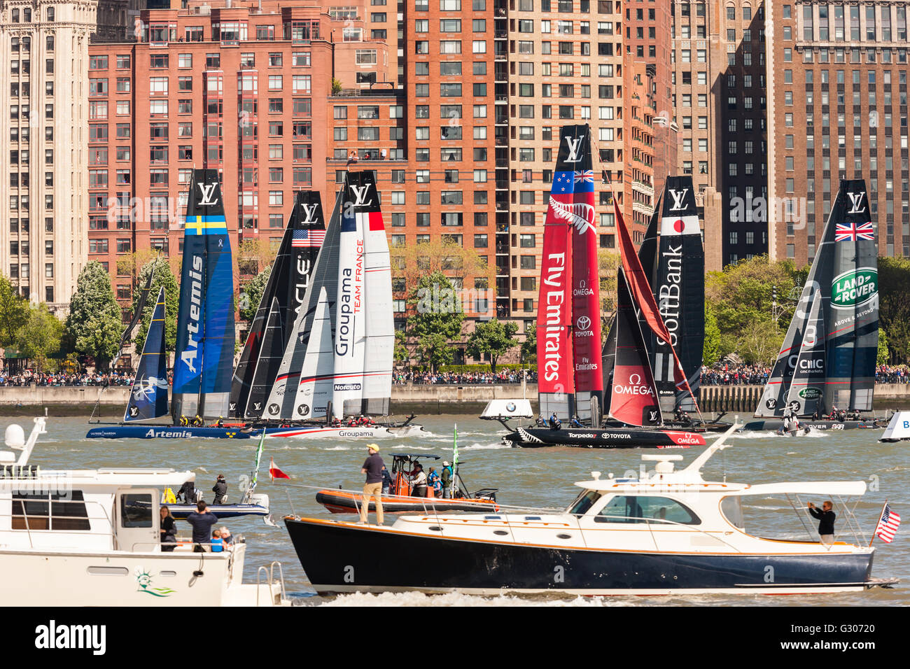 Louis Vuitton America’s Cup World Series team catamarans race on the Hudson River course surrounded by spectator boats. Stock Photo