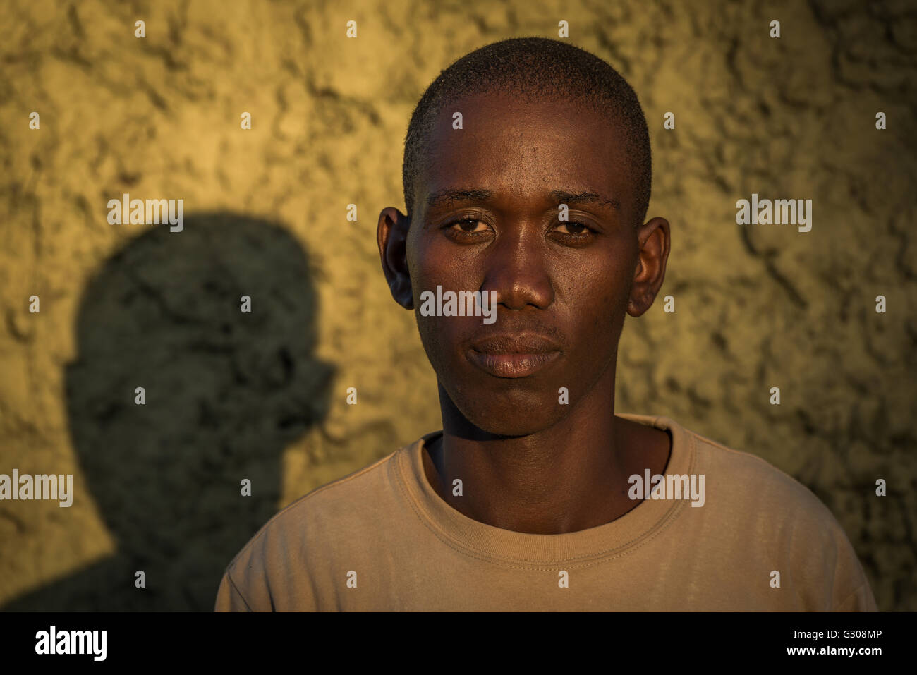Head and shoulders of young black man Stock Photo - Alamy