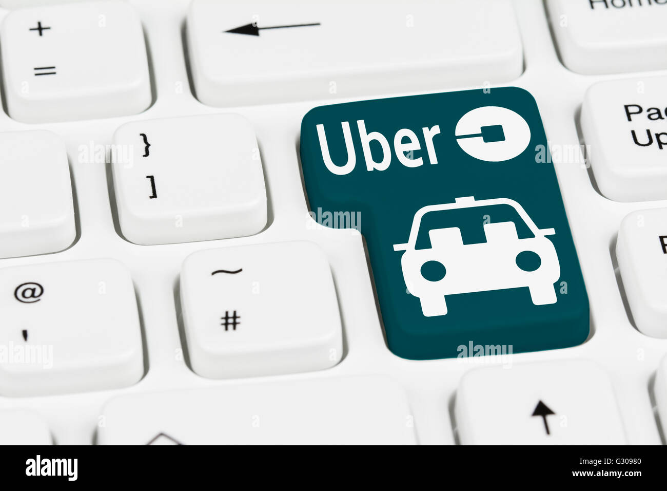 Uber taxi button on a computer keyboard. Stock Photo
