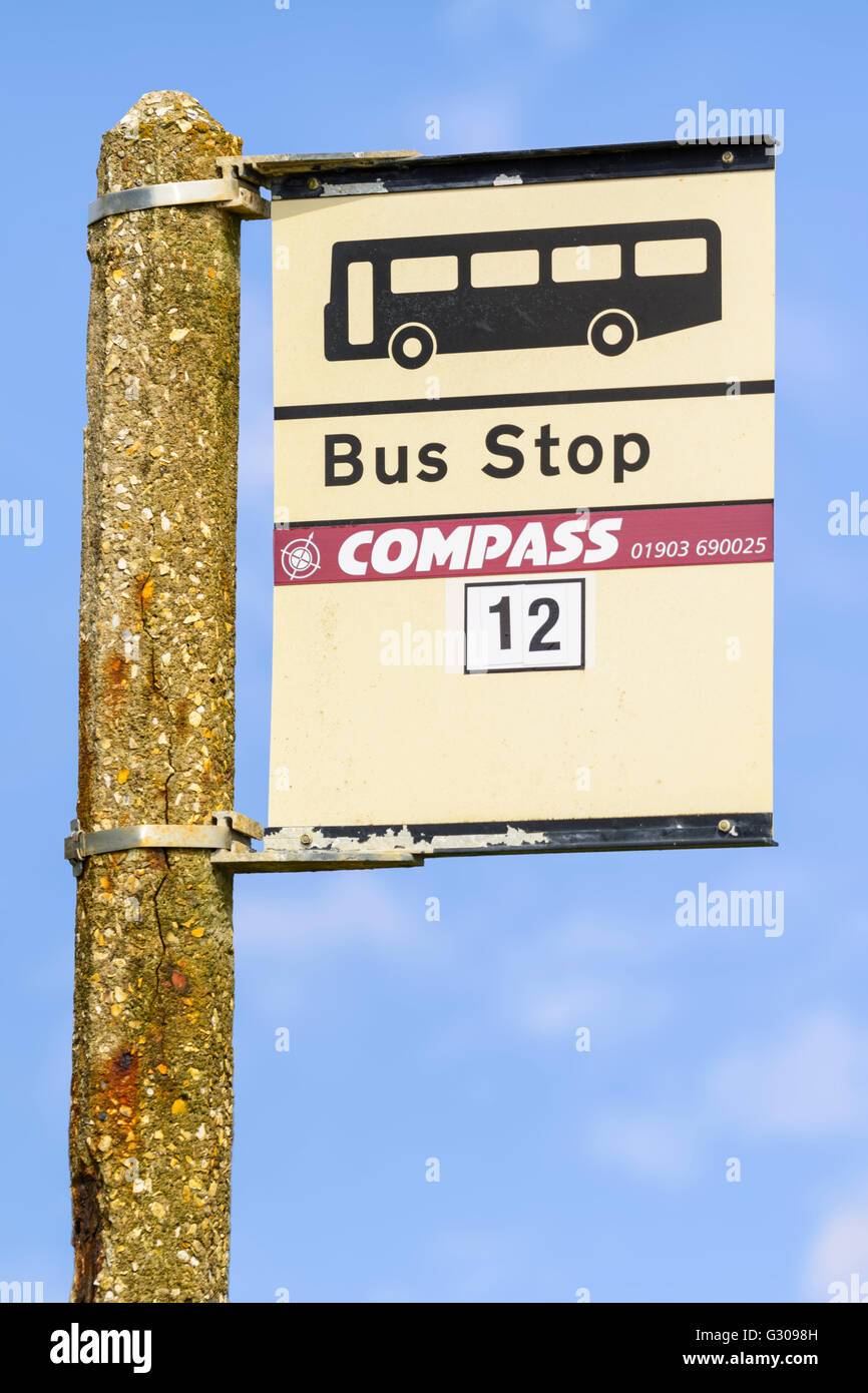 Compass bus stop against blue sky, in the UK. Stock Photo