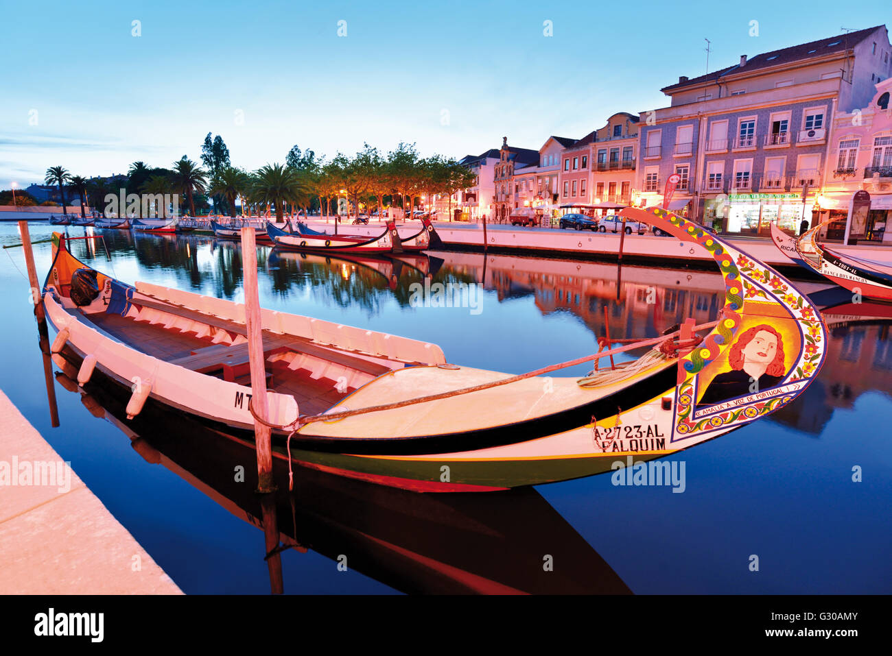 Portugal: Nocturnal view of a traditional Moliceiro boat with painting of Fado singer Amalia in the Canal Central Stock Photo