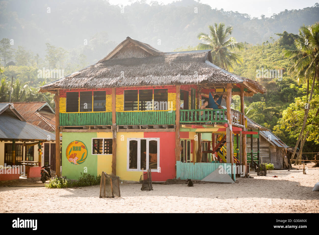 Rasta (Rastafarian) coloured beachfront accommodation at Sungai Pinang, near Padang in West Sumatra, Indonesia, Southeast Asia Stock Photo