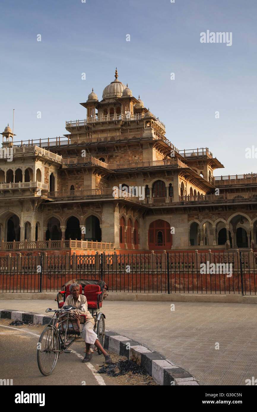 Rickshaw rider resting outside the ornate Albert Hall museum in the ...