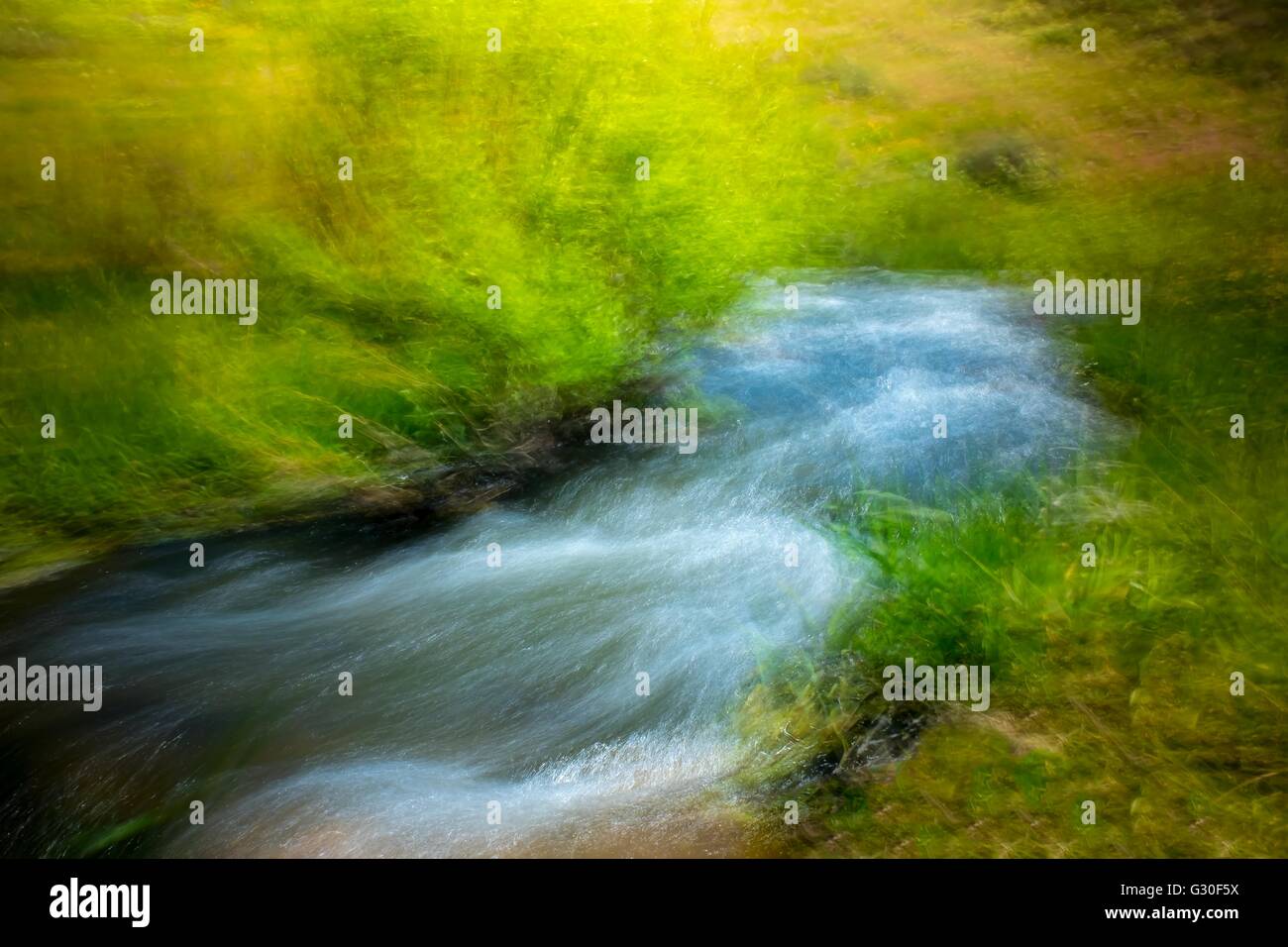 Impressionist style photograph of a stream Stock Photo