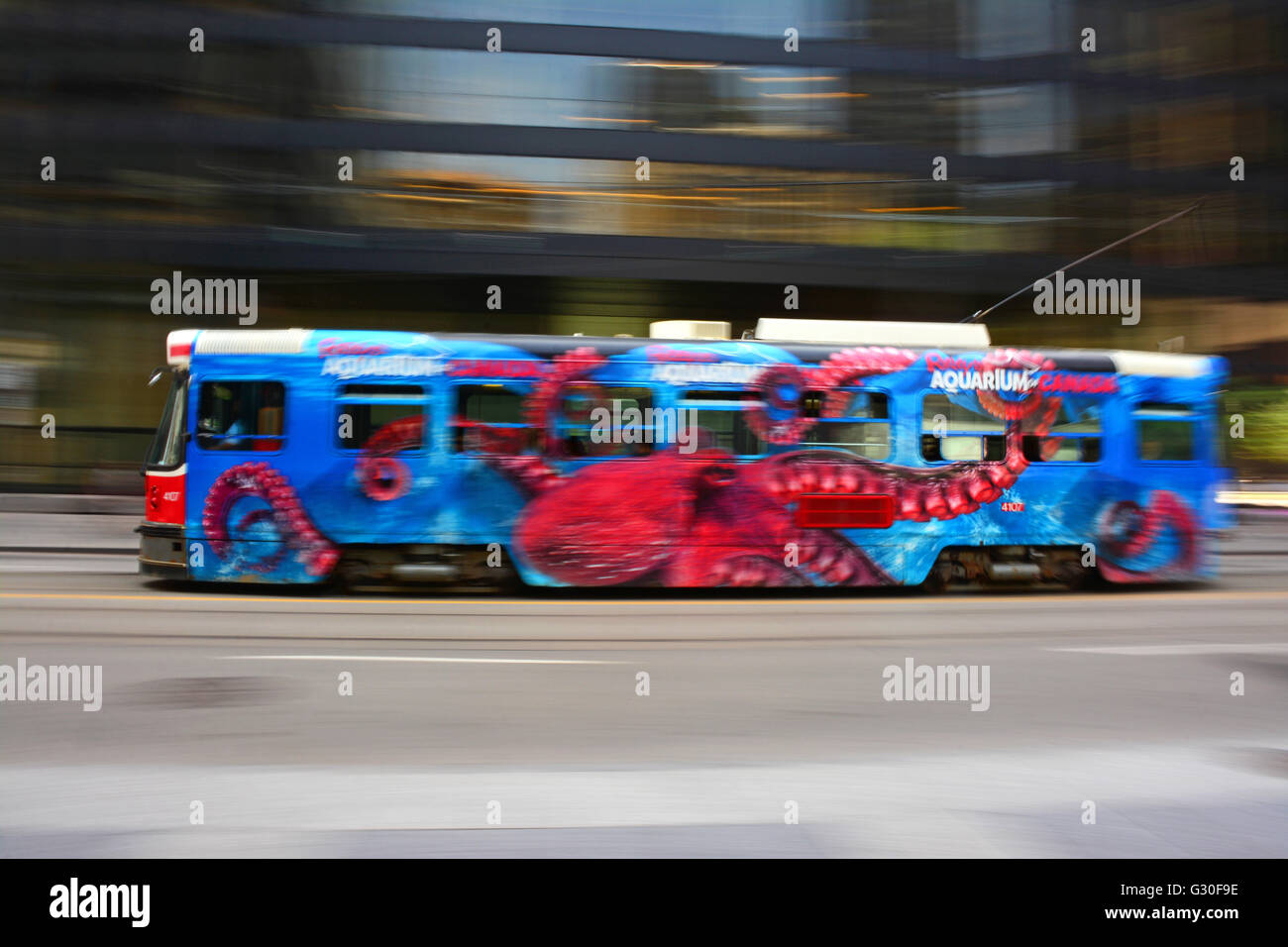Painted streetcar in blurred motion, Toronto, Canada Stock Photo