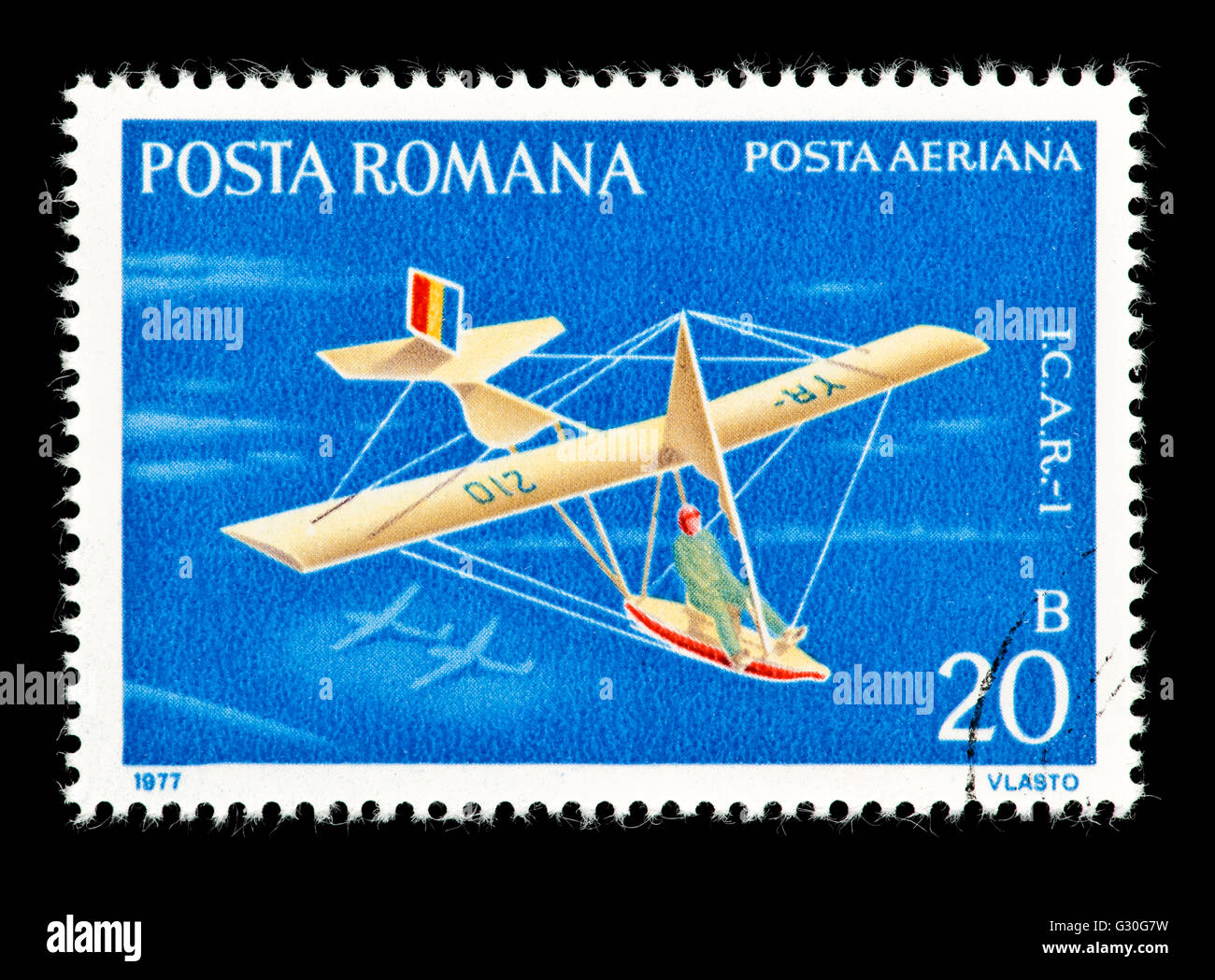 Postage stamp from Romania depicting an I.C.A.R. - 1 glider. Stock Photo