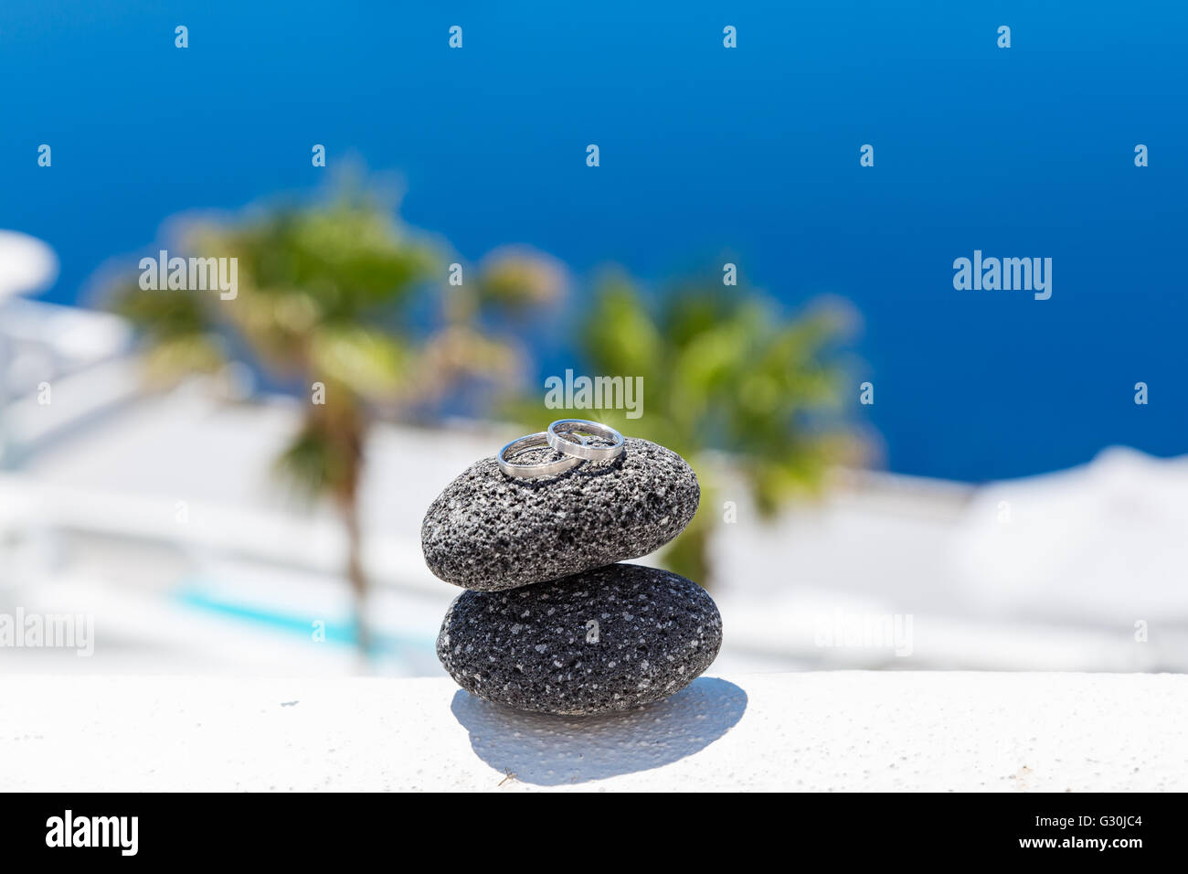Wedding rings on stones, on sea background Stock Photo - Alamy