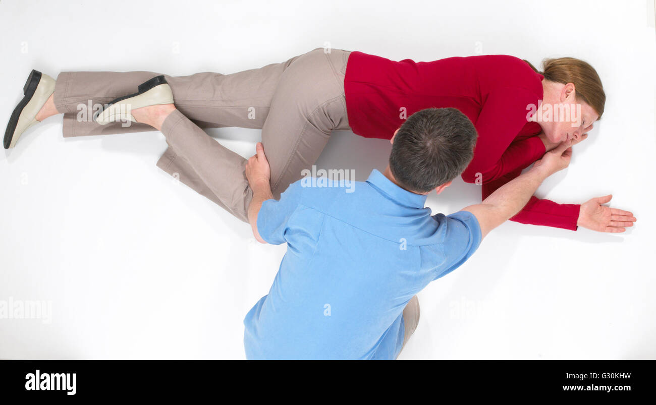 First aid, step by step guide to putting someone in recovery position