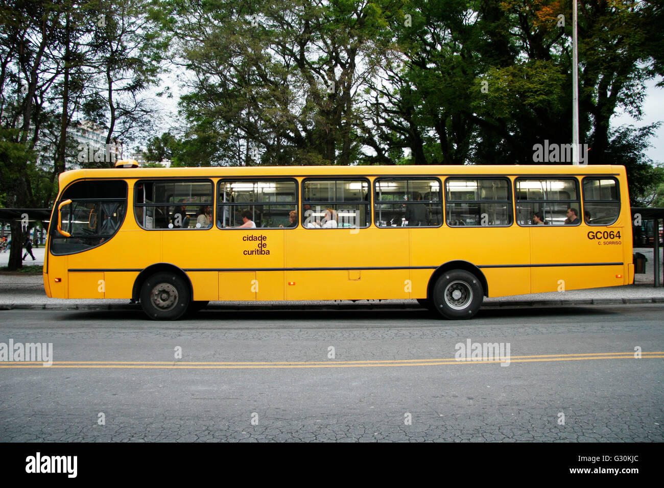 South America, Brazil, Parana, Cidade de Curitiba, yellow single-decker city bus, side view Stock Photo