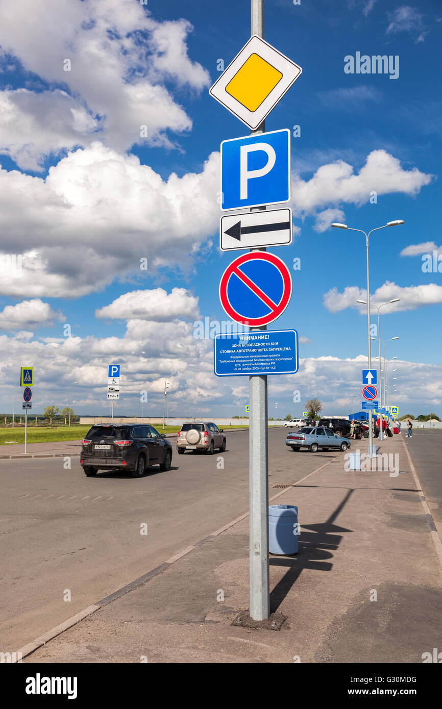 Traffic signs at the car parking in the terminal Samara Kurumoch Airport in summer sunny day Stock Photo