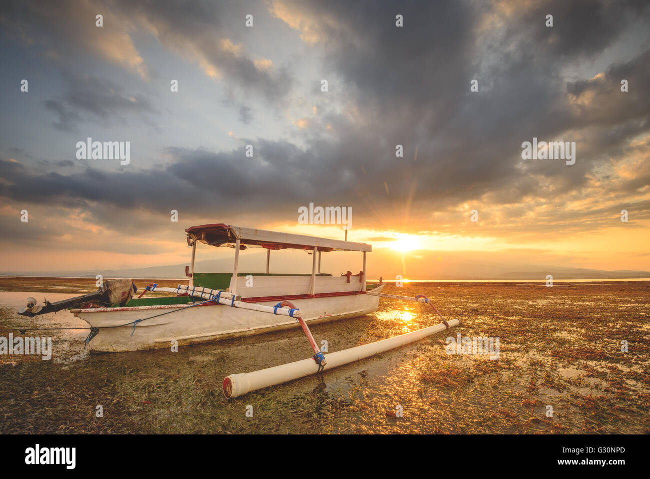 Watching the sun set over Lombok on Gili Lampu Island Stock Photo