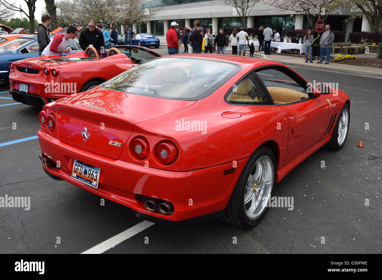 A red Ferrari on display at a car show. Stock Photo
